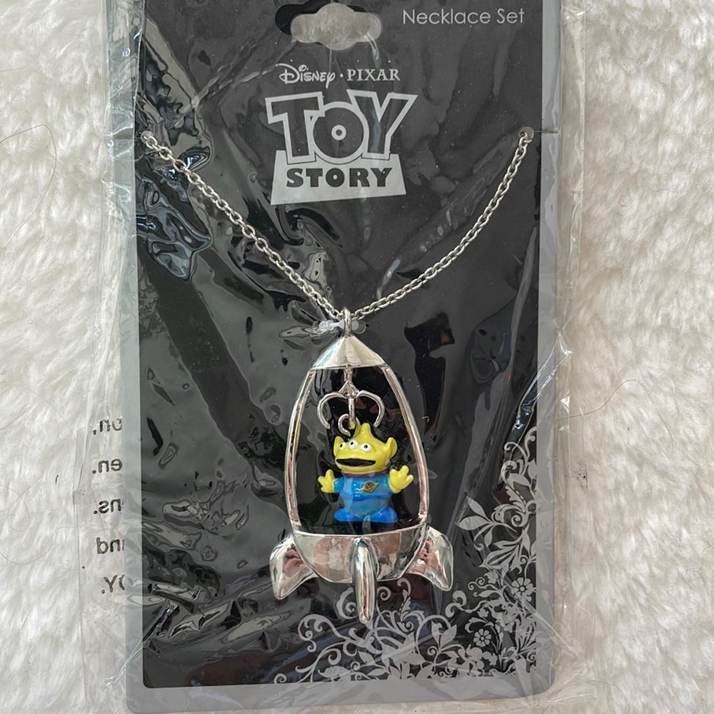 New in box unopened Disney Pixar Toy Story alien ship necklace Neon Tuesday